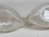 pair of clear glass vases on a white surface