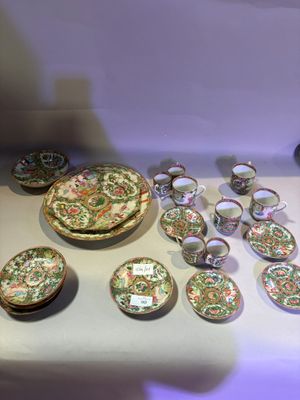 many plates and bowls sitting on a table