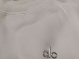the back of a white t - shirt with the do logo on it