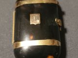 a black case with a gold trim on a table