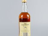 an image of a bottle of whisky sitting on top of a table