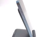 a cell phone that is sitting on top of a stand