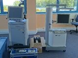 a room with a computer, printer, and other equipment in it
