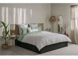a picture of a bedroom with a bed and a mirror