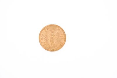 a gold coin on a white surface with a white background