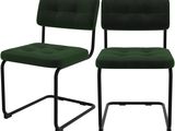 deux chaises vertes avec des pieds en métal et une structure noire