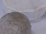 a white object on the table next to a silver object