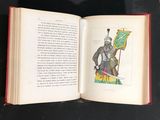 an open book with a picture of a knight holding a sword
