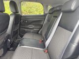 the back seats of a car are black and grey in color