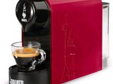a close up of a coffee machine with a cup of coffee