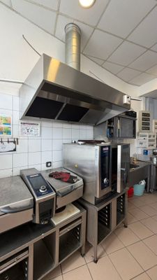 a kitchen with a stove, oven, and other appliances in it