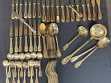a lot of silver spoons and spoon spoons on the table