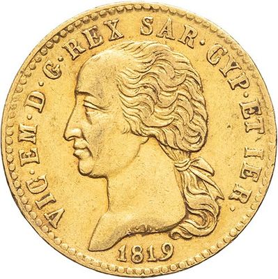 a close up of a gold coin with a woman ' s face on it