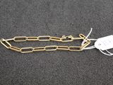 a close up of a chain with a tag attached to it