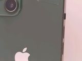 a close up of the back of an apple iphone with a cracked screen
