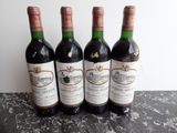 three bottles of wine sitting on top of a table next to each other