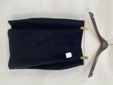 pair of black pants and a wooden hanger on a white background