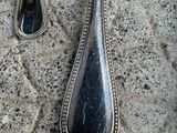 two spoons that are sitting on a table