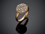 a gold ring with diamonds on a black surface