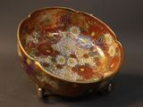 a small bowl that is sitting on a stand