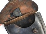 a hand that is holding an old purse