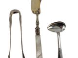three spoons, a knife, and a spoon on a white background