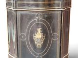 a black and gold cabinet with a gold emblem on it