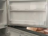 an open refrigerator that is sitting in a kitchen