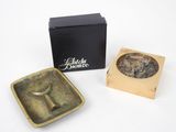 an image of a box with a metal object in it and a box with a metal object in it