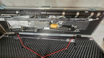 a metal case with a bunch of tools inside of it