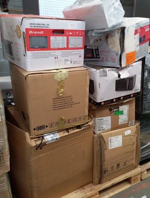 boxes stacked on top of each other on a pallet in a warehouse