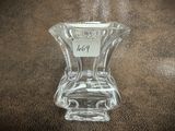 a glass vase that has a price tag on it