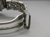 a close up of a watch on a table