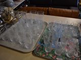 many glasses and trays sitting on a table