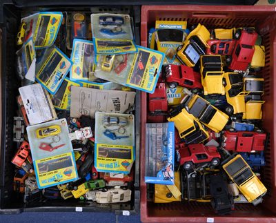 a red box filled with toy cars and other toys