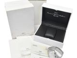 a box with a watch and a watch in it