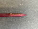a red pen that has been left on the table