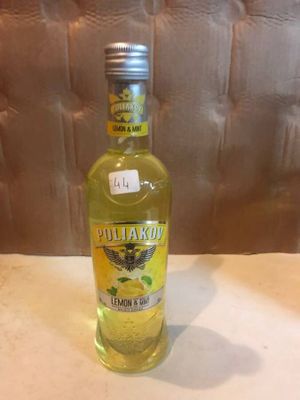 a bottle of olive oil sitting on a counter