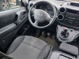 the interior of a small car with a steering wheel and dashboard