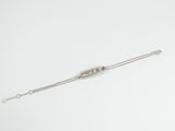 silver plated chain bracelet with a clasp on a white background