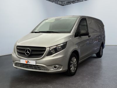 the mercedes van is parked in a large room in a building