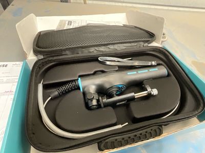 a box with a hair dryer in it and a hair brush in it