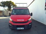 a red van that is parked in a parking lot