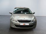 a silver car that is parked in a showroom
