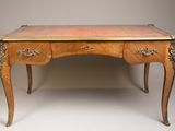 an antique writing desk with two drawers and a drawer on top of it