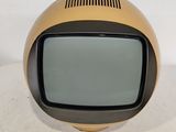 a small television sitting on top of a white table