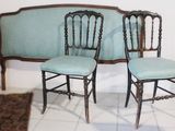 two chairs that are sitting next to each other