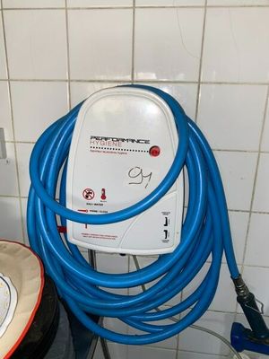 a blue hose that is connected to an electric charger
