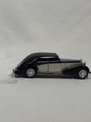 a toy car that is sitting in the snow