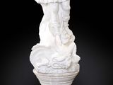 marble statue of a woman holding a child on a pedestal